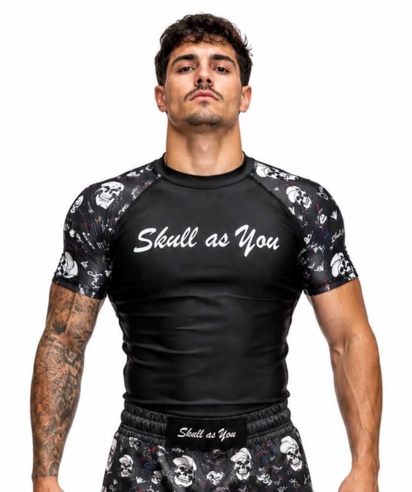 Athlete wearing Skull As You Skin n Bones Black short sleeve BJJ rash guard during Brazilian Jiu-Jitsu training