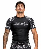 Athlete wearing Skull As You Skin n Bones Black short sleeve BJJ rash guard during Brazilian Jiu-Jitsu training